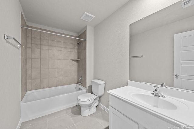 full bathroom featuring tile patterned flooring, vanity, toilet, and tiled shower / bath