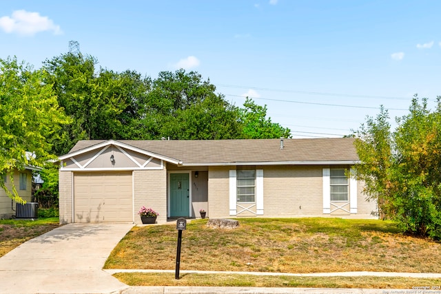 ranch-style house with central AC unit, a front yard, and a garage