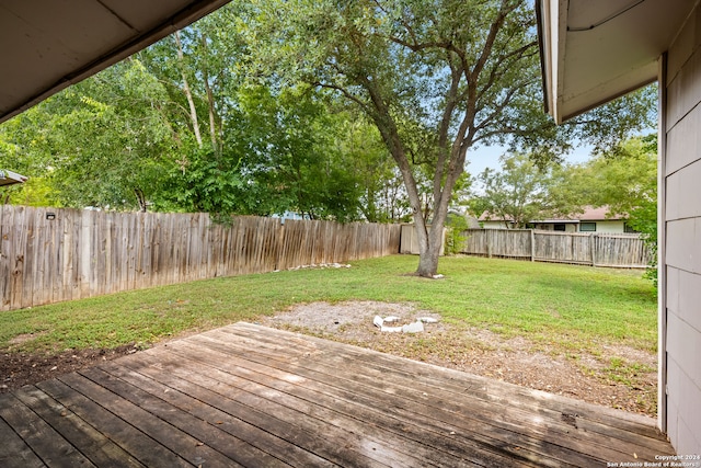 deck featuring a lawn