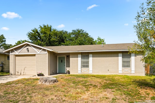 single story home with a garage and a front lawn