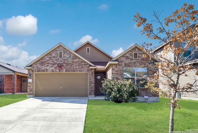 view of front of house with a garage and a front yard