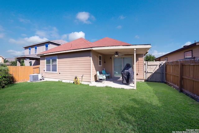 back of house featuring central air condition unit, a patio, a lawn, and ceiling fan