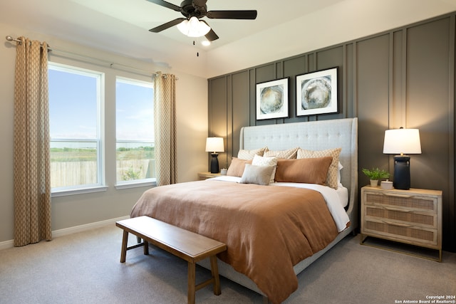 carpeted bedroom featuring ceiling fan