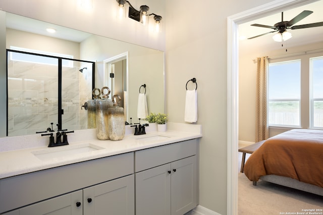 bathroom featuring vanity, a shower with door, and ceiling fan