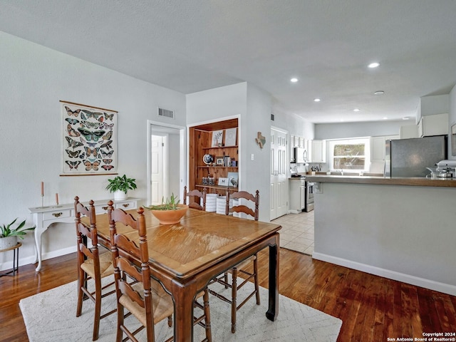 dining area featuring light hardwood / wood-style floors