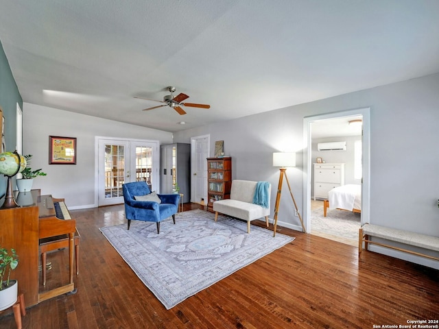 interior space featuring ceiling fan, lofted ceiling, french doors, dark wood-type flooring, and an AC wall unit