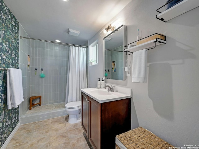 bathroom with tile patterned floors, vanity, toilet, and curtained shower