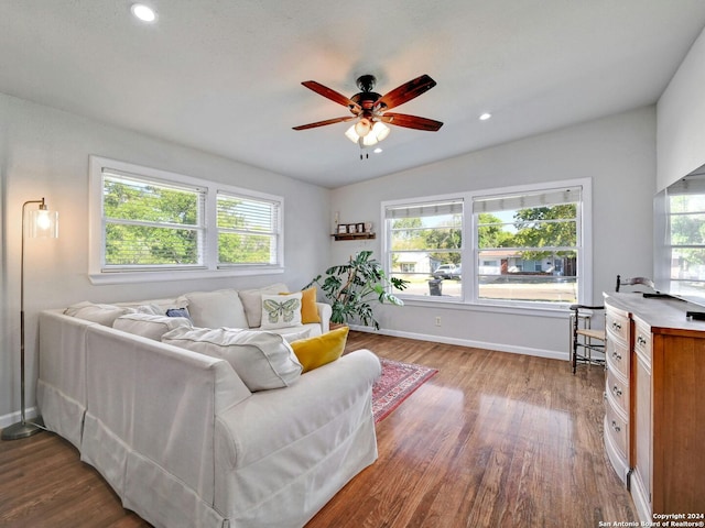 living room featuring plenty of natural light, hardwood / wood-style floors, and ceiling fan