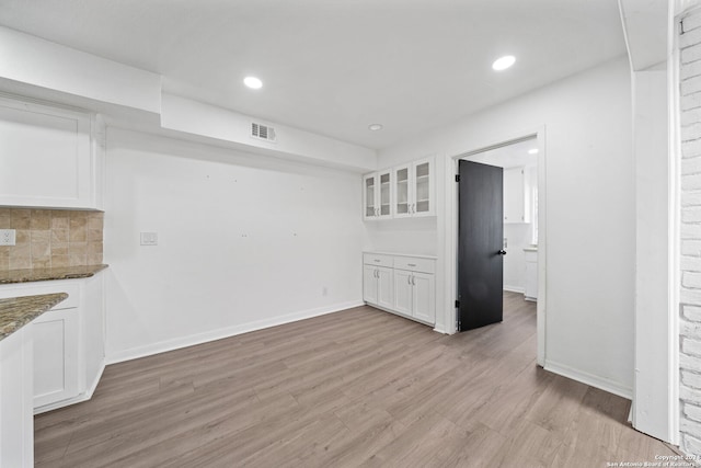 unfurnished living room with light hardwood / wood-style flooring