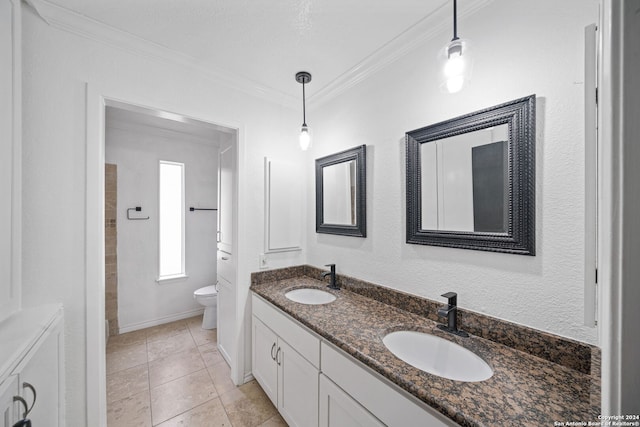 bathroom featuring vanity, tile patterned floors, ornamental molding, and toilet