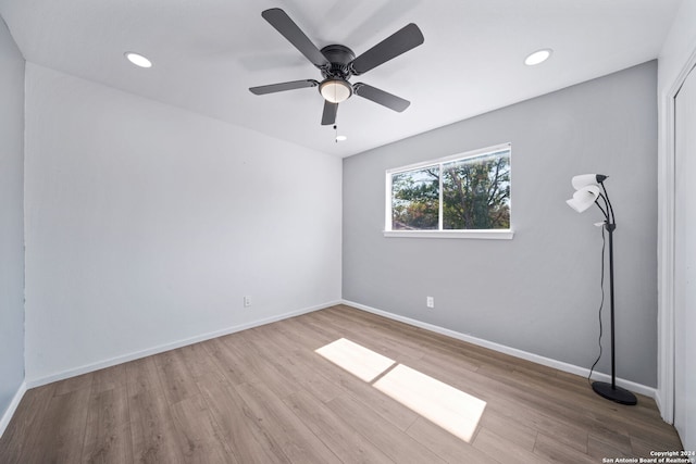 spare room featuring ceiling fan and light hardwood / wood-style floors