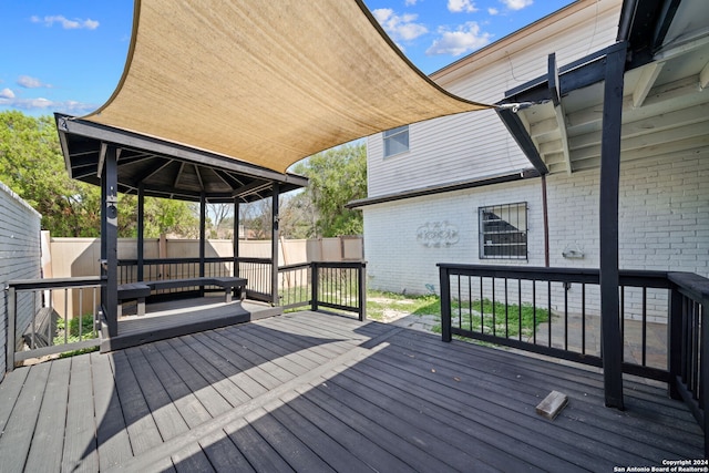 wooden deck featuring a gazebo