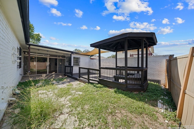 view of yard with a wooden deck