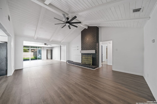 unfurnished living room featuring beam ceiling, dark wood-type flooring, a fireplace, and ceiling fan