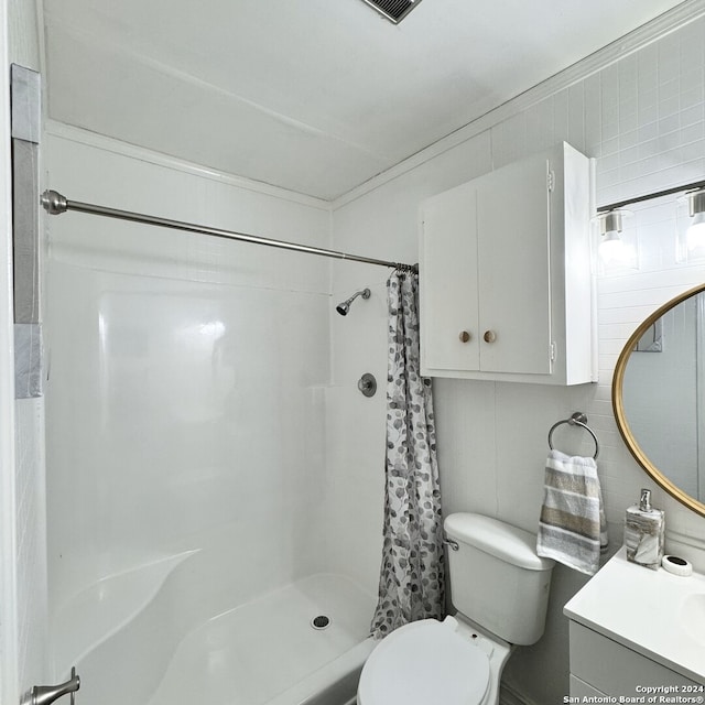 bathroom featuring vanity, tile walls, toilet, and a shower with shower curtain