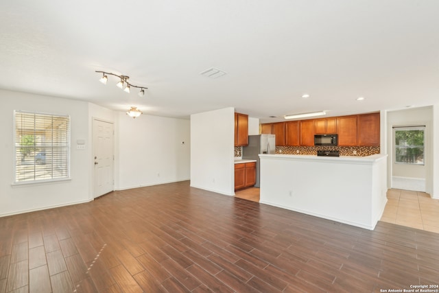 unfurnished living room featuring hardwood / wood-style floors