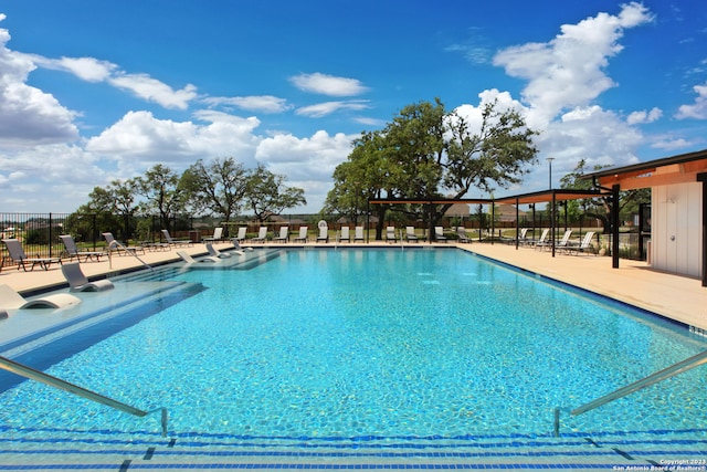 view of swimming pool with a patio