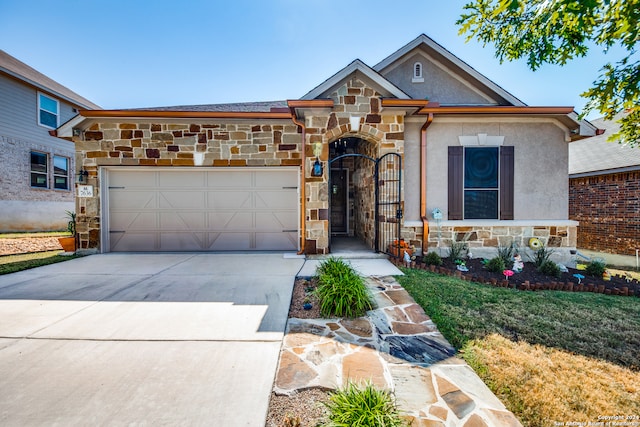 view of front of house featuring a garage and a front lawn