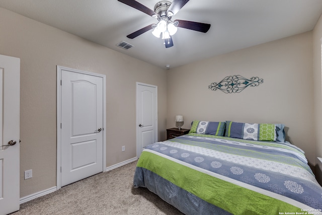 carpeted bedroom featuring ceiling fan