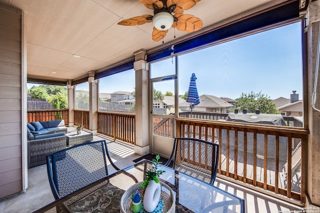 exterior space with an outdoor living space and ceiling fan