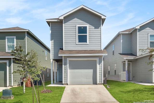 view of front property with a garage and a front lawn