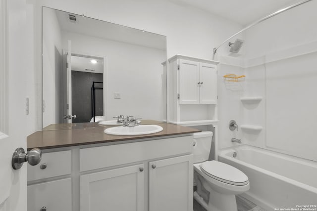 full bathroom featuring tub / shower combination, toilet, and vanity