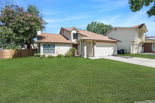 view of front of house with a front yard and a garage