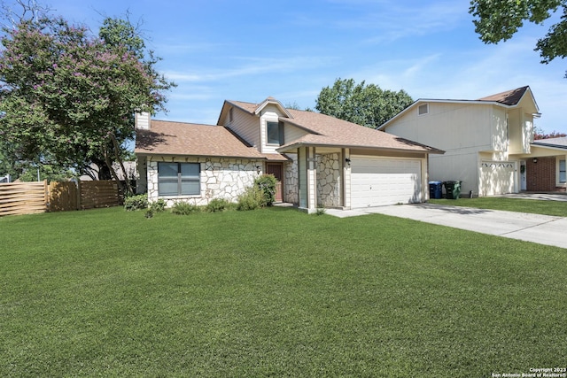 6906 Country Elm, San Antonio, TX 78240 - view of front of home with a front yard, fence, concrete driveway, an attached garage, and stone siding
