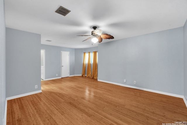 empty room featuring light wood-type flooring and ceiling fan