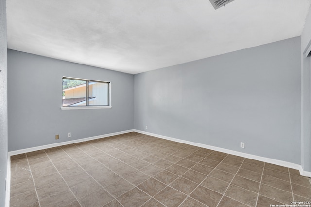 view of tiled spare room