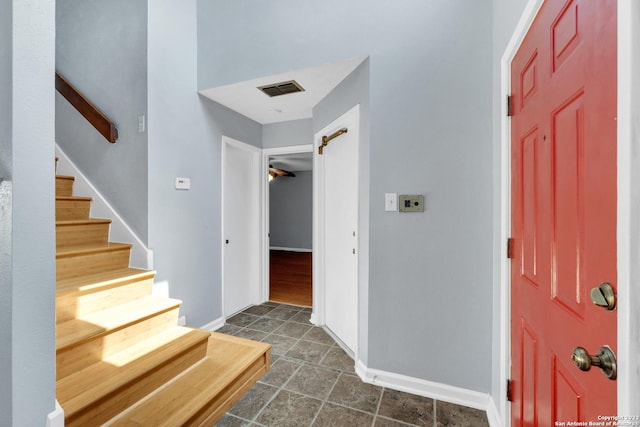 6906 Country Elm, San Antonio, TX 78240 - foyer entrance with dark tile patterned floors, baseboards, visible vents, and stairway