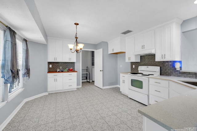 kitchen with an inviting chandelier, white electric stove, decorative backsplash, hanging light fixtures, and white cabinetry