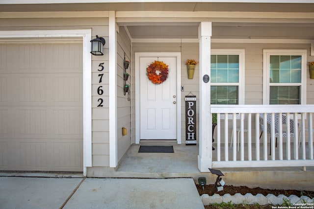 doorway to property with a garage