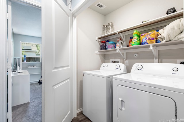 washroom featuring dark carpet and washer and dryer