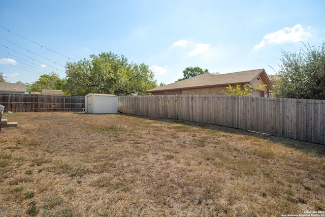 5762 Sunset Pt, San Antonio, TX 78242 - view of yard with a fenced backyard, an outdoor structure, and a shed