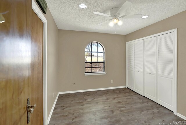6776 Green Valley Rd, Cibolo, TX 78108 - unfurnished room with plenty of natural light, visible vents, and wood finished floors
