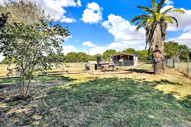 view of yard with a rural view