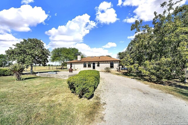 6776 Green Valley Rd, Cibolo, TX 78108 - back of house with a lawn, a chimney, and a patio area