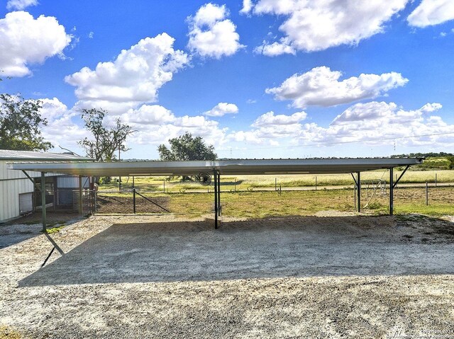 6776 Green Valley Rd, Cibolo, TX 78108 - view of car parking with fence, a rural view, and a carport