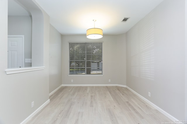 unfurnished room featuring light hardwood / wood-style floors