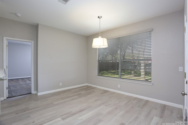 unfurnished room featuring light wood-type flooring