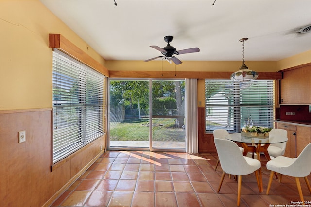 dining space with ceiling fan, light tile patterned floors, and a healthy amount of sunlight