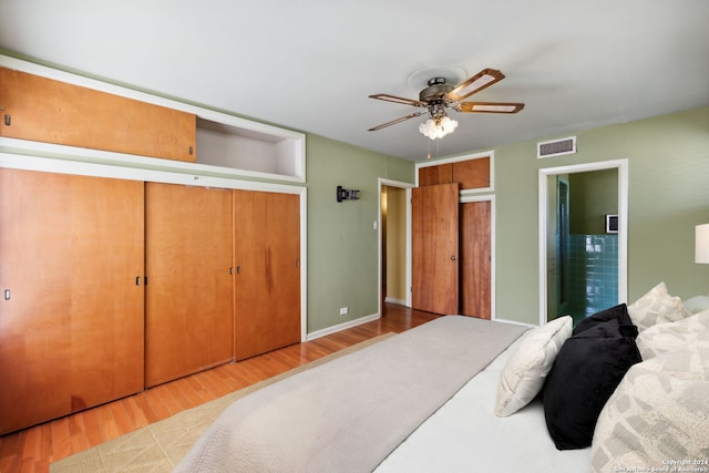 bedroom with ceiling fan and light hardwood / wood-style floors