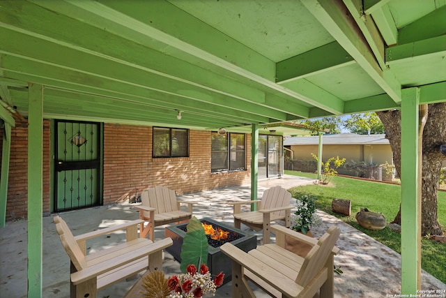 view of patio / terrace featuring an outdoor fire pit