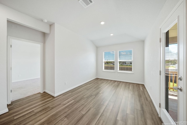 spare room with hardwood / wood-style flooring