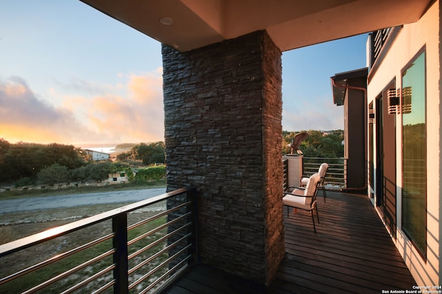 view of balcony at dusk