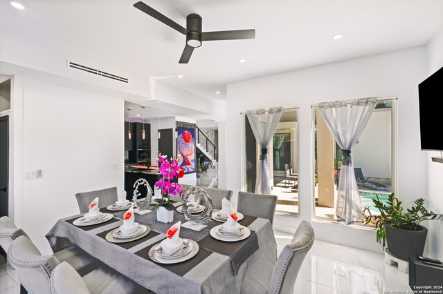 dining space featuring ceiling fan