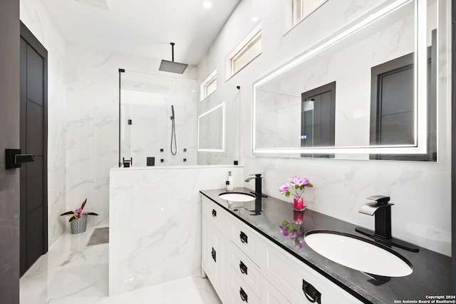 bathroom with a tile shower, tile walls, vanity, and backsplash