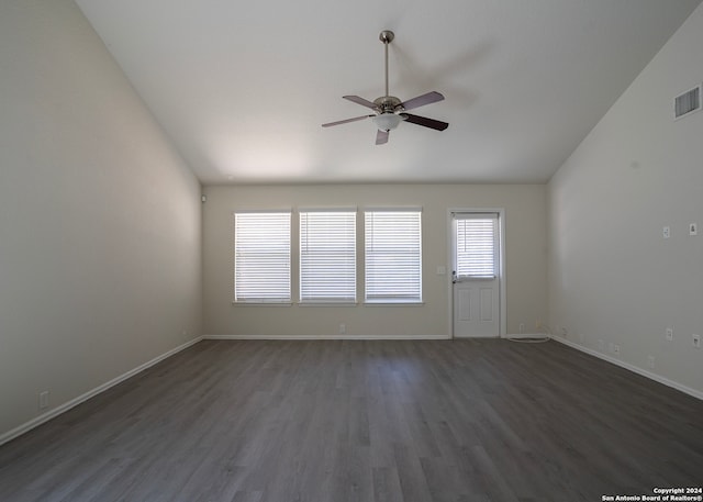 spare room featuring lofted ceiling, ceiling fan, and dark hardwood / wood-style floors