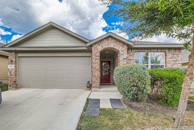 ranch-style home featuring a garage